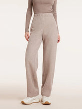 a woman in knit straight full length pants